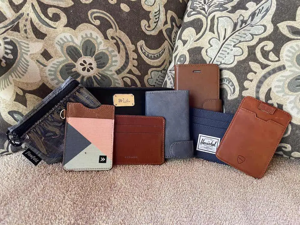 collection of wallets and purses on chair