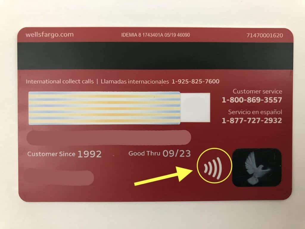 Credit card with arrow pointing to contactless symbol. RFID wallets that prevent credit card scanning. 