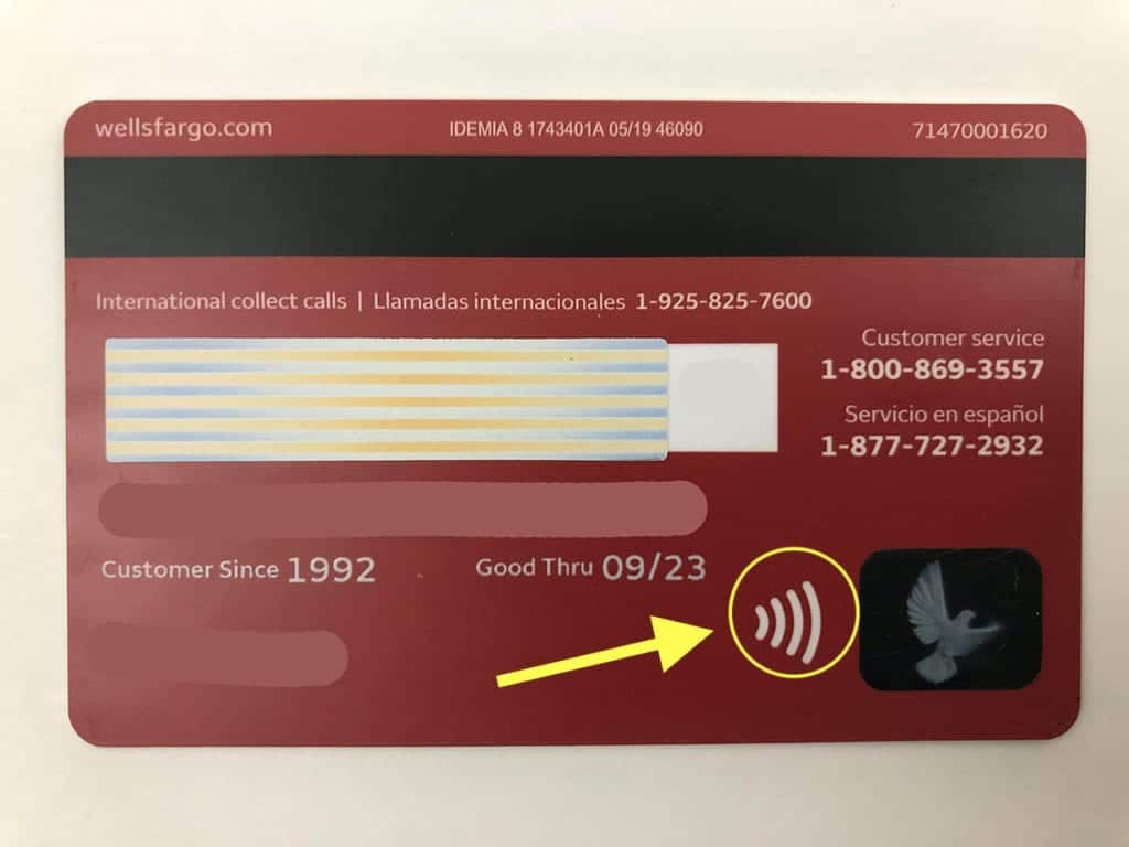 Credit card with arrow pointing to contactless symbol. RFID wallets that prevent credit card scanning.
