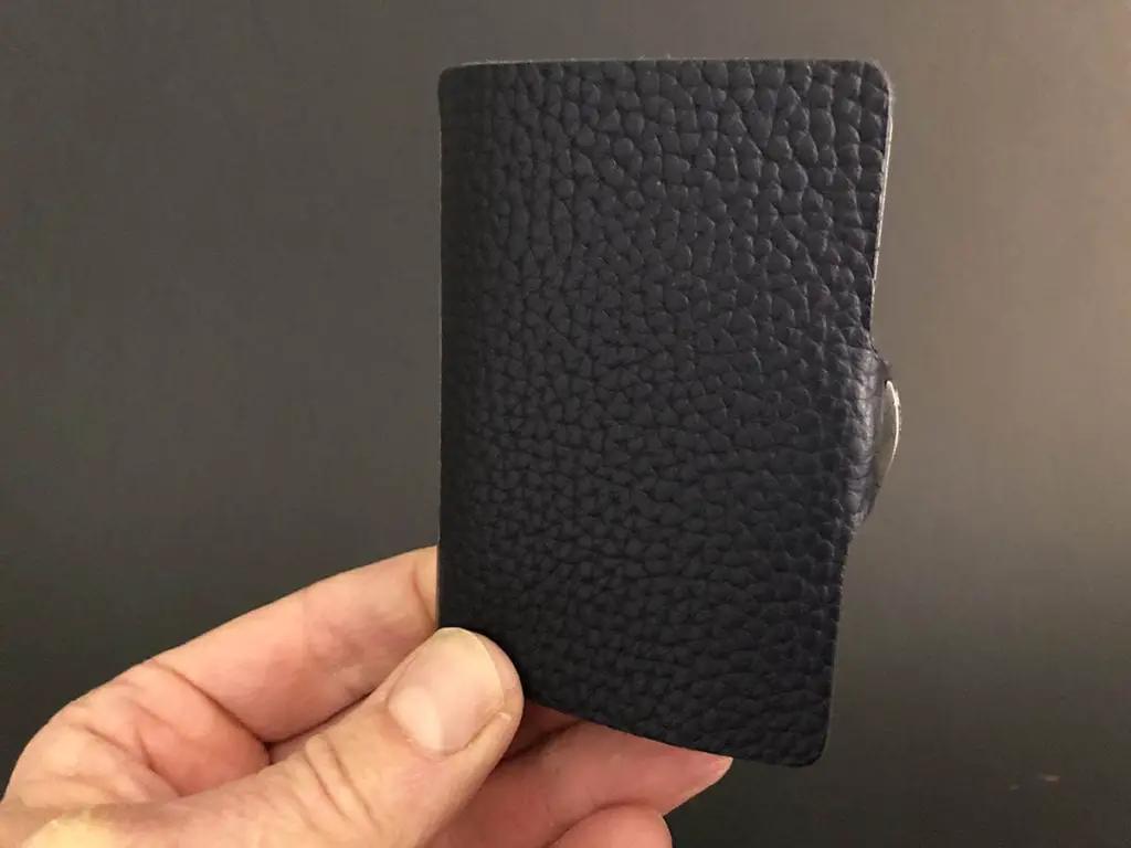 I-clip wallet showing leather cover with pebble texture.