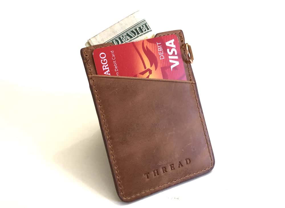 Thread smart wallet showing leather back plus card and cash