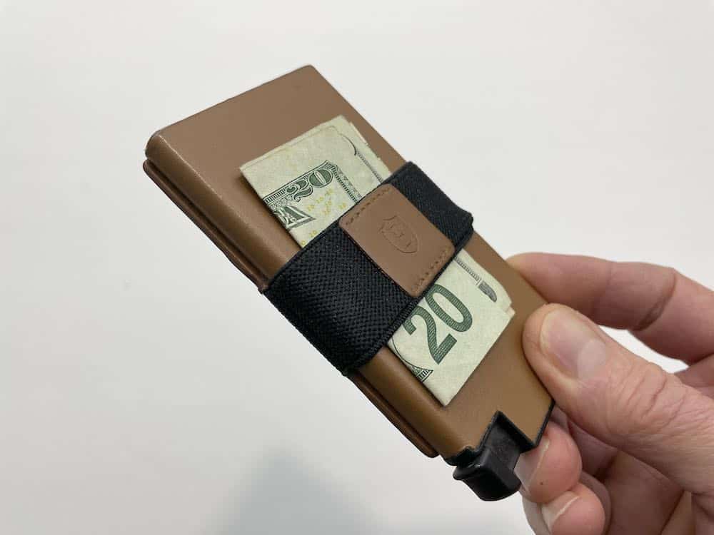 Ekster Senate wallet with cash under money strap