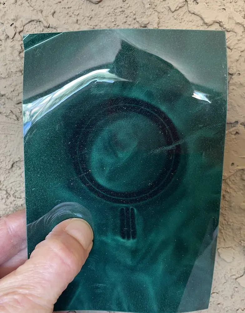 Same view with magnetic sensitive sheet exposing the embedded magnets.