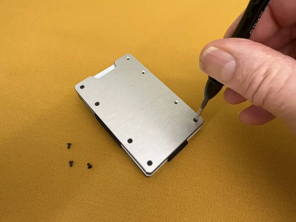 Aviator Slide One removing screws from outer plate