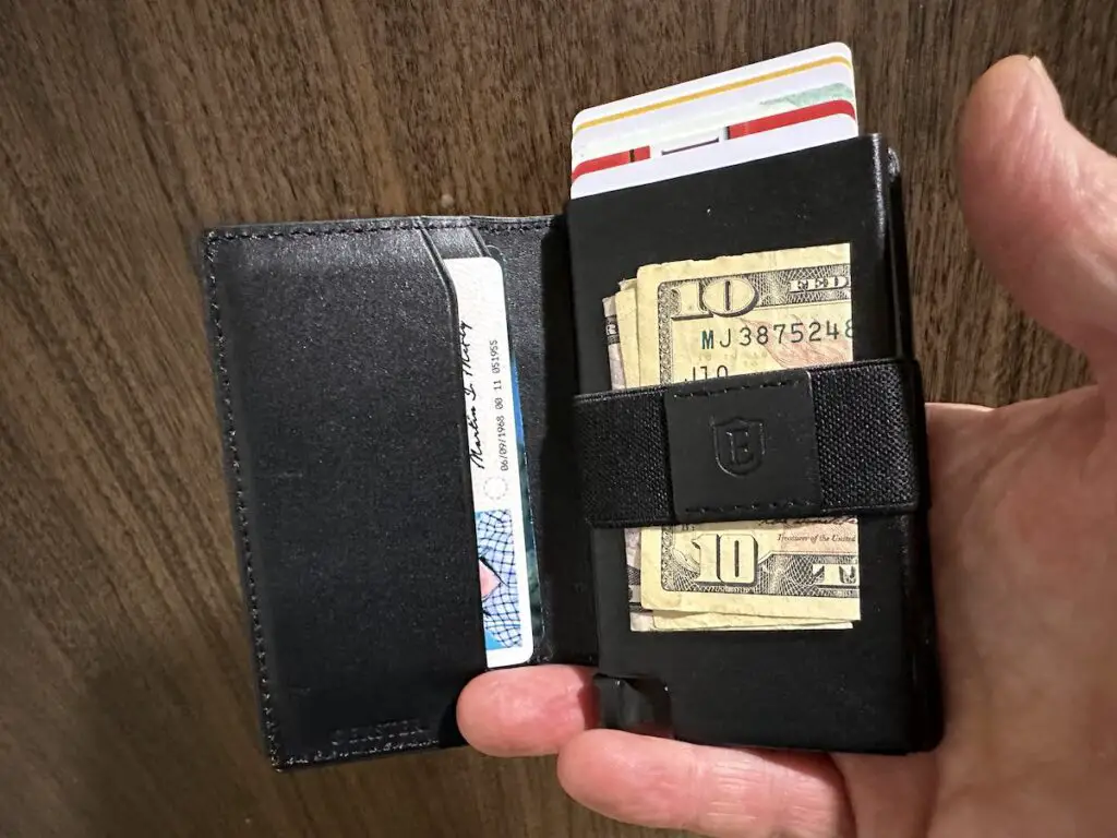 Ekster AirTag wallet showing cards and cash