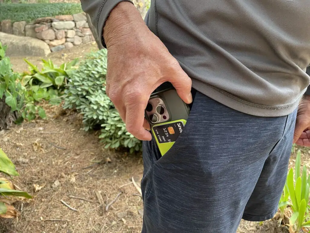 placing phone and wallet in front pocket